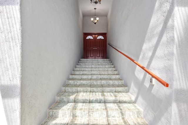 15-1023 Ala Heiau Rd, Keaau, HI 96749 - stairway with a chandelier and a textured wall