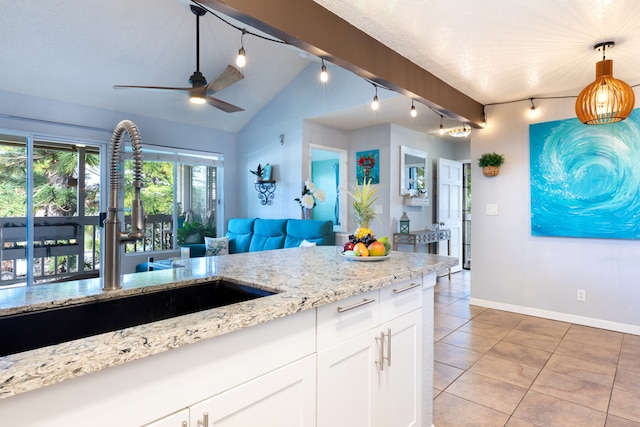 68-3890 Lua Kula St Unit 1007, Waikoloa, HI 96738 - kitchen with a sink, light tile patterned floors, ceiling fan, baseboards, and light stone counters