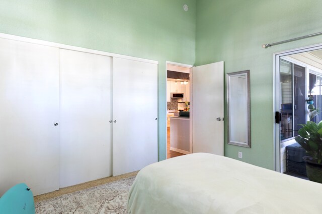 68-3890 Lua Kula St Unit 1007, Waikoloa, HI 96738 - carpeted bedroom with a towering ceiling and a closet