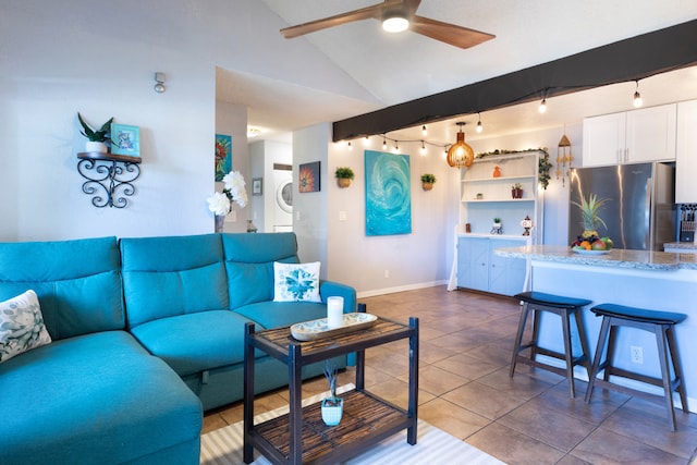 68-3890 Lua Kula St Unit 1007, Waikoloa, HI 96738 - tiled living room with baseboards, a ceiling fan, rail lighting, and stacked washer and clothes dryer