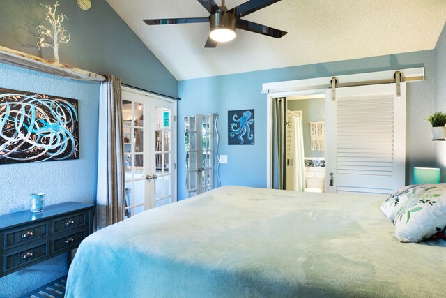 68-3890 Lua Kula St Unit 1007, Waikoloa, HI 96738 - bedroom with vaulted ceiling, french doors, a barn door, a ceiling fan, and ensuite bath