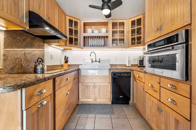 75-5719 Kona Plz Unit 203, Kailua-Kona, HI 96740 - kitchen with black appliances, a sink, extractor fan, light tile patterned flooring, and dark countertops