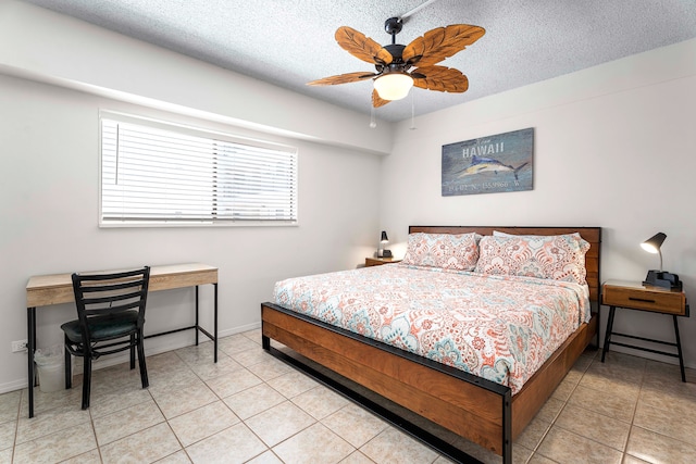 75-5719 Kona Plz Unit 203, Kailua-Kona, HI 96740 - bedroom with a textured ceiling, light tile patterned floors, baseboards, and a ceiling fan