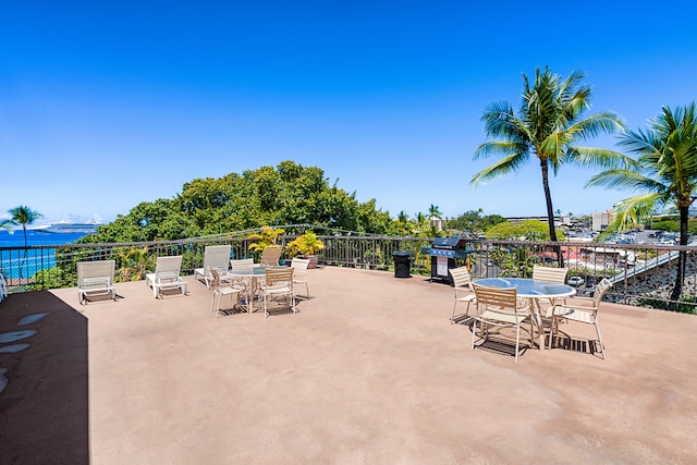 75-5719 Kona Plz Unit 203, Kailua-Kona, HI 96740 - view of patio / terrace with outdoor dining space, grilling area, and a water view