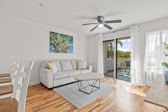 75-6081 Alii Dr Unit V106, Kailua-Kona, HI 96740 - living area with light wood-style floors and ceiling fan