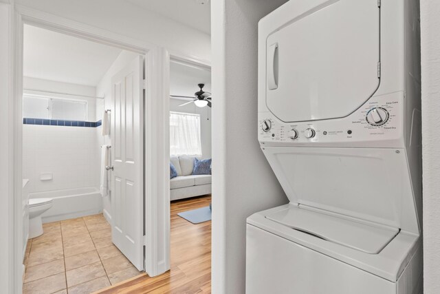 75-6081 Alii Dr Unit V106, Kailua-Kona, HI 96740 - laundry area with stacked washer / dryer, a ceiling fan, and light tile patterned floors