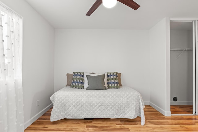 75-6081 Alii Dr Unit V106, Kailua-Kona, HI 96740 - bedroom with wood finished floors, baseboards, a closet, and a ceiling fan