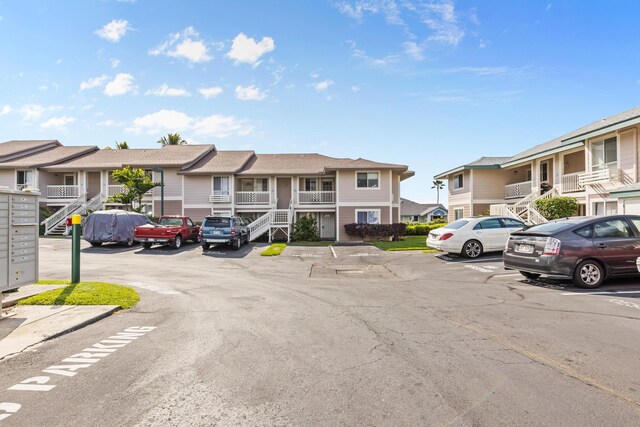 75-6081 Alii Dr Unit V106, Kailua-Kona, HI 96740 - view of asphalt street featuring a residential view and stairway