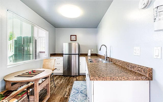 15-1688 18th Ave, Maia Keaau, HI 96749 - kitchen featuring freestanding refrigerator, a sink, white cabinets, and dark wood-style flooring