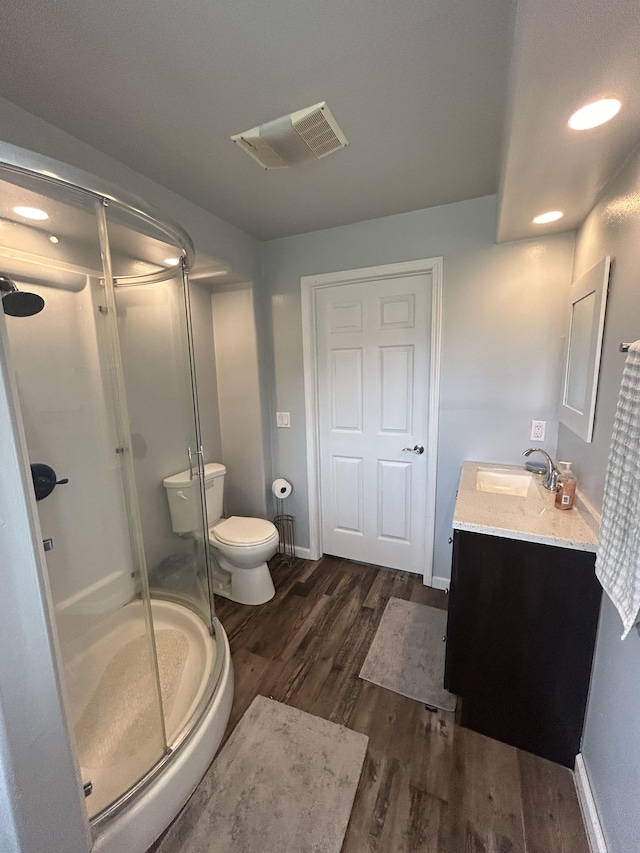 15-1688 18th Ave, Maia Keaau, HI 96749 - bathroom with vanity, wood finished floors, a shower stall, and toilet