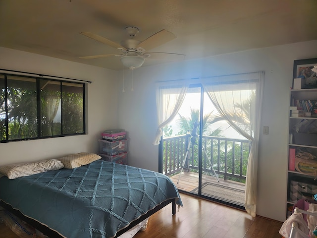 87-3207 Carissa Rd, Captain Cook, HI 96704 - bedroom with access to outside, wood finished floors, and a ceiling fan