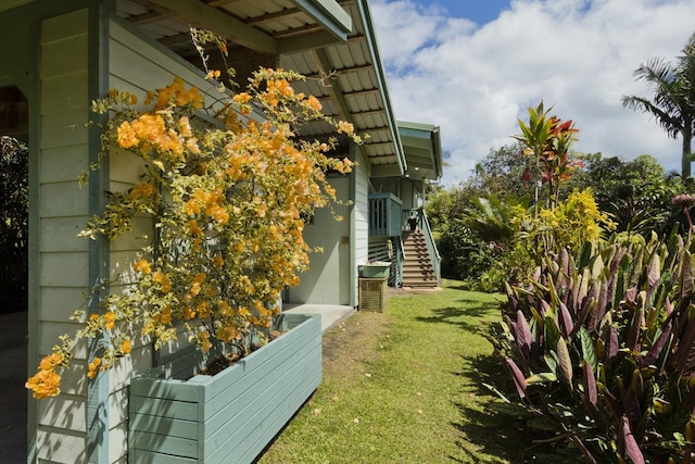 13-3571 Pomaikai St, Pahoa, HI 96778 - view of side of property featuring stairs and a lawn