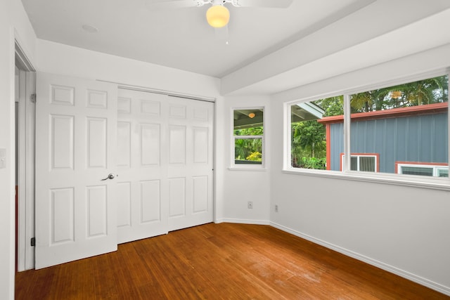6450 Olohena Rd, Kapaa, HI 96746 - unfurnished bedroom with wood finished floors, baseboards, a closet, and ceiling fan