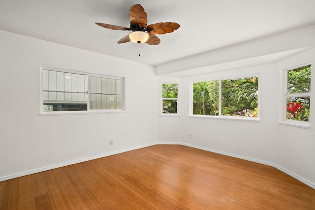 6450 Olohena Rd, Kapaa, HI 96746 - unfurnished room with baseboards, wood finished floors, and ceiling fan