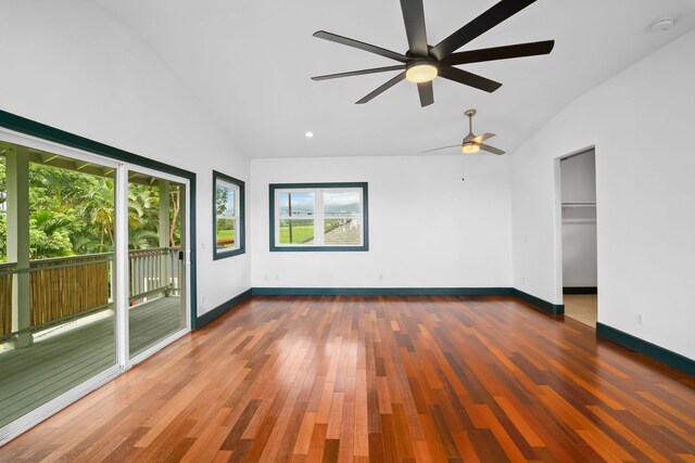 6450 Olohena Rd, Kapaa, HI 96746 - unfurnished bedroom with access to exterior, wood finished floors, baseboards, ceiling fan, and high vaulted ceiling
