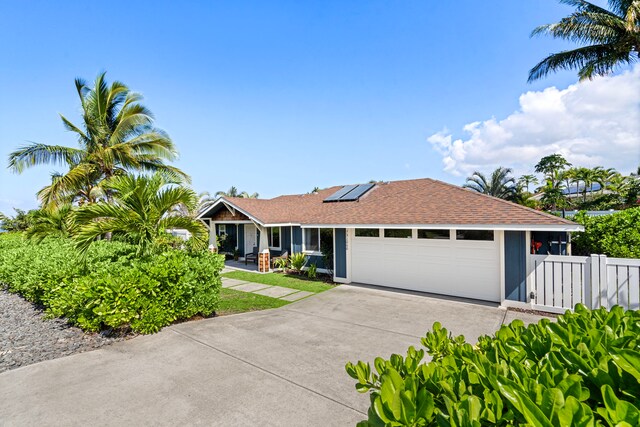 73-1060 Kuuleialoha Cir, Kailua-Kona, HI 96740 - single story home featuring solar panels, a garage, concrete driveway, and roof with shingles