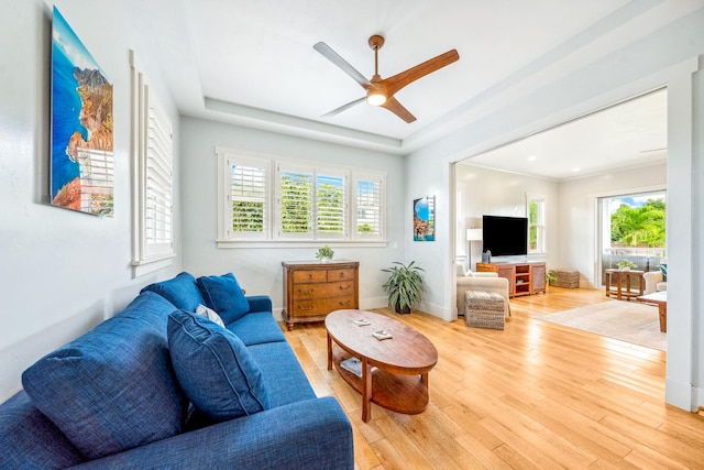 2344 Halalii Pl, Koloa, HI 96756 - living area featuring healthy amount of natural light, light wood-style floors, a ceiling fan, and baseboards