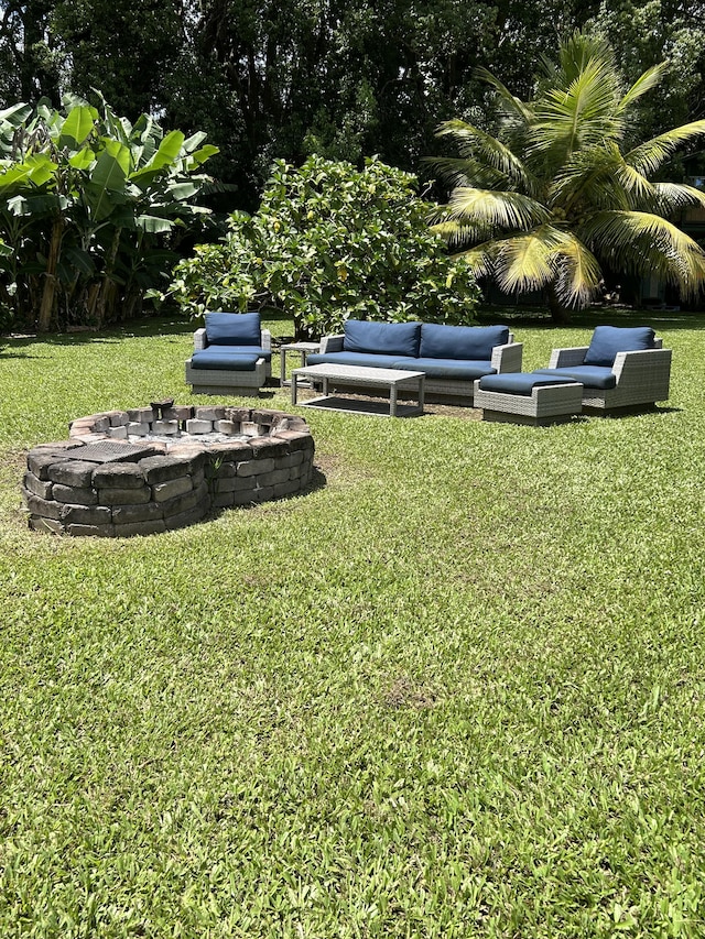 6670-G Kahuna Rd Unit 2, Kapaa, HI 96746 - view of grassy yard with an outdoor living space with a fire pit