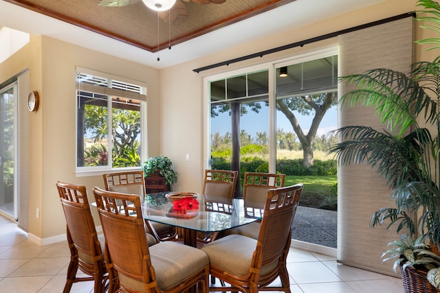 68-180 Waikoloa Beach Dr Unit J1, Waikoloa, HI 96738 - dining area featuring a ceiling fan, light tile patterned flooring, a tray ceiling, and baseboards