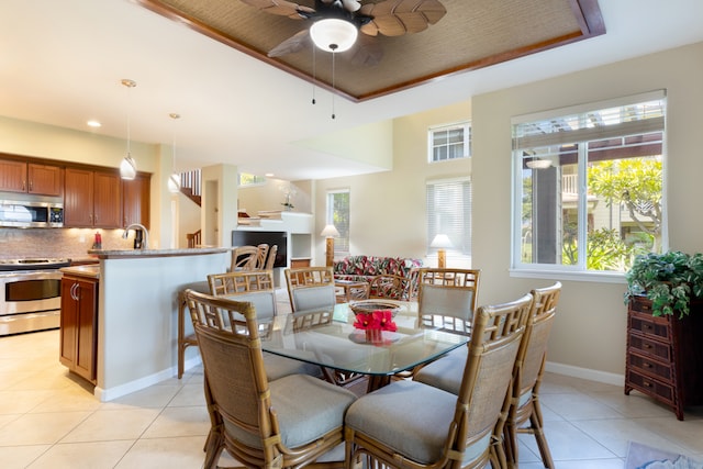 68-180 Waikoloa Beach Dr Unit J1, Waikoloa, HI 96738 - dining room featuring a ceiling fan, light tile patterned floors, healthy amount of natural light, baseboards, and recessed lighting