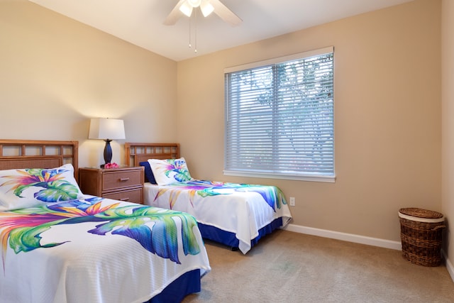 68-180 Waikoloa Beach Dr Unit J1, Waikoloa, HI 96738 - bedroom featuring carpet, baseboards, and a ceiling fan
