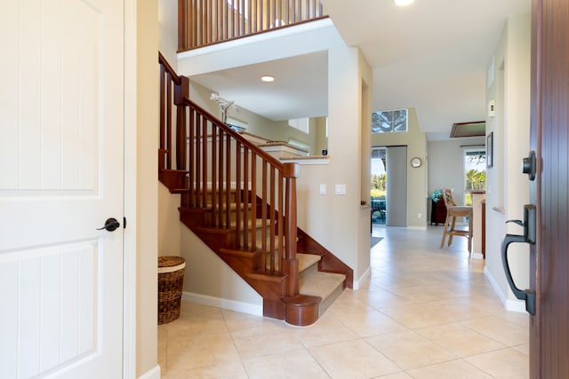 68-180 Waikoloa Beach Dr Unit J1, Waikoloa, HI 96738 - staircase with tile patterned floors, baseboards, and recessed lighting