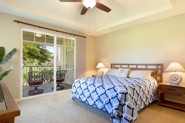 68-180 Waikoloa Beach Dr Unit J1, Waikoloa, HI 96738 - carpeted bedroom with a tray ceiling, access to exterior, and a ceiling fan