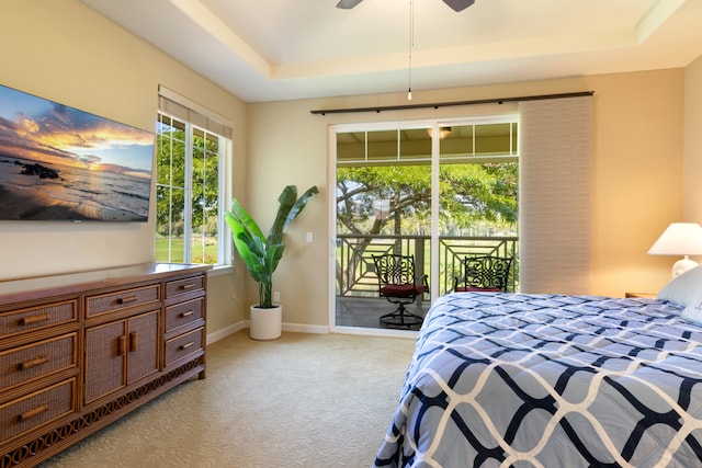68-180 Waikoloa Beach Dr Unit J1, Waikoloa, HI 96738 - bedroom with a raised ceiling, access to exterior, light colored carpet, and multiple windows
