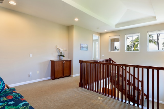 68-180 Waikoloa Beach Dr Unit J1, Waikoloa, HI 96738 - corridor featuring an upstairs landing, light colored carpet, recessed lighting, baseboards, and a tray ceiling