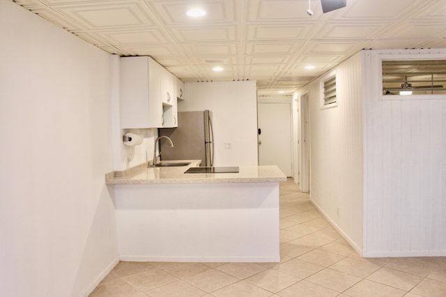 75-5719 Kona Plz Unit 119, Kailua-Kona, HI 96740 - kitchen featuring a sink, recessed lighting, freestanding refrigerator, white cabinetry, and light tile patterned floors