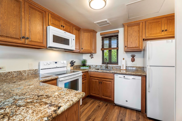 75-6040 Alii Dr Unit 504, Kailua-Kona, HI 96740 - kitchen featuring white appliances, a sink, and brown cabinetry