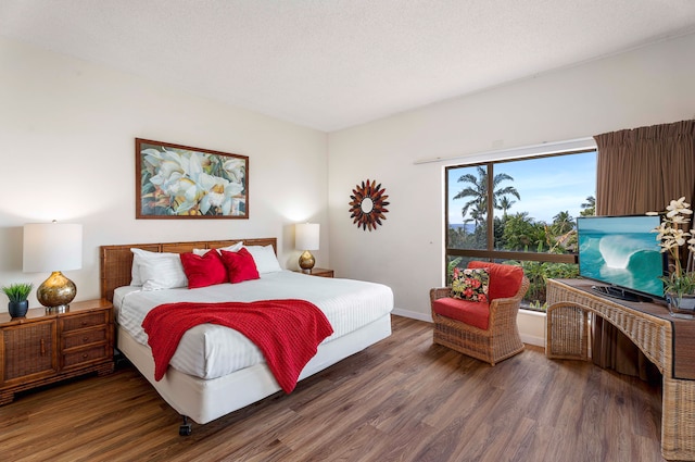75-6040 Alii Dr Unit 504, Kailua-Kona, HI 96740 - bedroom featuring wood finished floors and baseboards