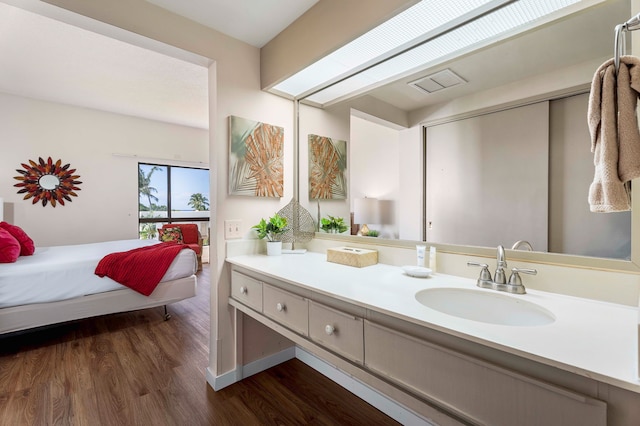 75-6040 Alii Dr Unit 504, Kailua-Kona, HI 96740 - bathroom with wood finished floors and vanity