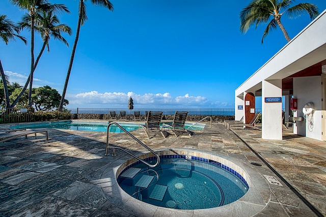 75-6040 Alii Dr Unit 504, Kailua-Kona, HI 96740 - community pool featuring a community hot tub and a patio area