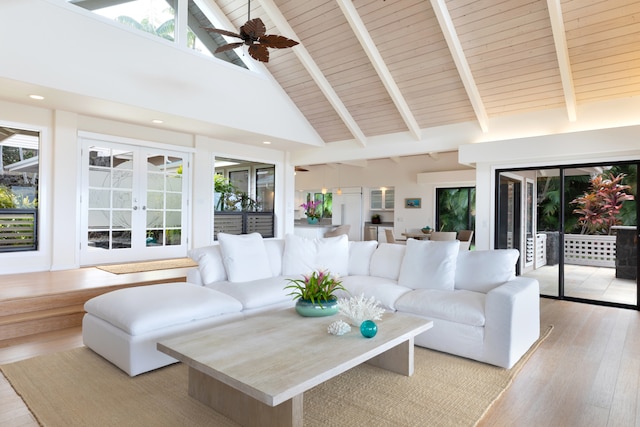 78-6846 Keaupuni St, Kailua-Kona, HI 96740 - living area with high vaulted ceiling, light wood-type flooring, french doors, a ceiling fan, and wood ceiling with exposed beams