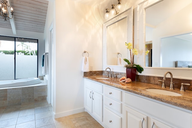 78-6846 Keaupuni St, Kailua-Kona, HI 96740 - full bath featuring double vanity, tile patterned flooring, a chandelier, a relaxing tiled tub, and baseboards