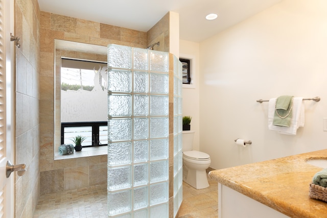 78-6846 Keaupuni St, Kailua-Kona, HI 96740 - bathroom featuring vanity, toilet, walk in shower, tile patterned floors, and a fireplace