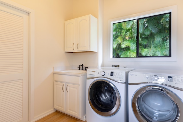 78-6846 Keaupuni St, Kailua-Kona, HI 96740 - laundry room with separate washer and dryer, cabinet space, and light wood-style floors