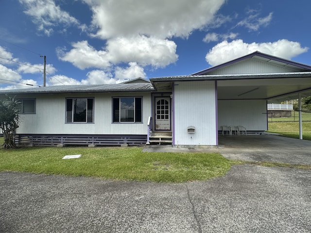 102 Puhili St, Hilo, HI 96720 - view of front of property with a carport, a front yard, and driveway