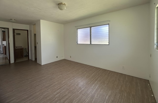 102 Puhili St, Hilo, HI 96720 - unfurnished room with wood finished floors and a smoke detector