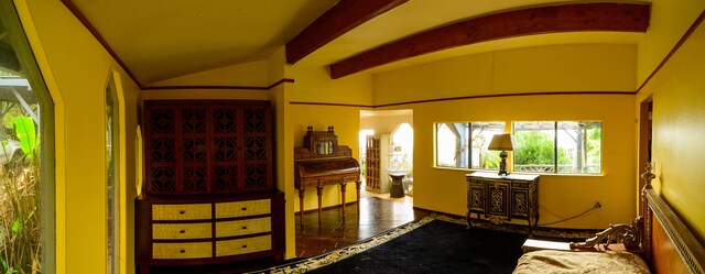 2239 Upper Kanaio Rd, Kula, HI 96790 - bedroom with vaulted ceiling and multiple windows