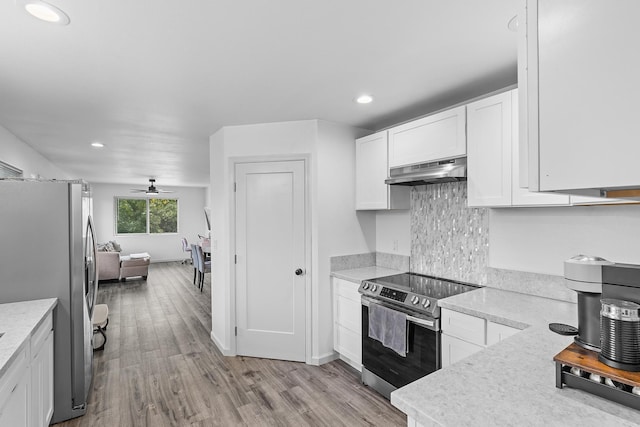 15-2042 14th Ave, Keaau, HI 96749 - kitchen with stainless steel appliances, under cabinet range hood, light wood-type flooring, white cabinets, and recessed lighting