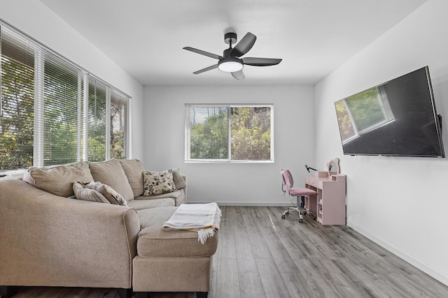 15-2042 14th Ave, Keaau, HI 96749 - living area featuring ceiling fan, wood finished floors, and baseboards