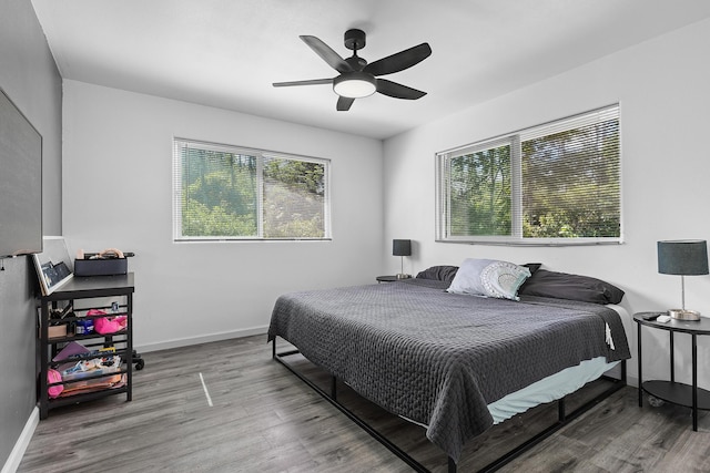 15-2042 14th Ave, Keaau, HI 96749 - bedroom with wood finished floors, baseboards, and a ceiling fan