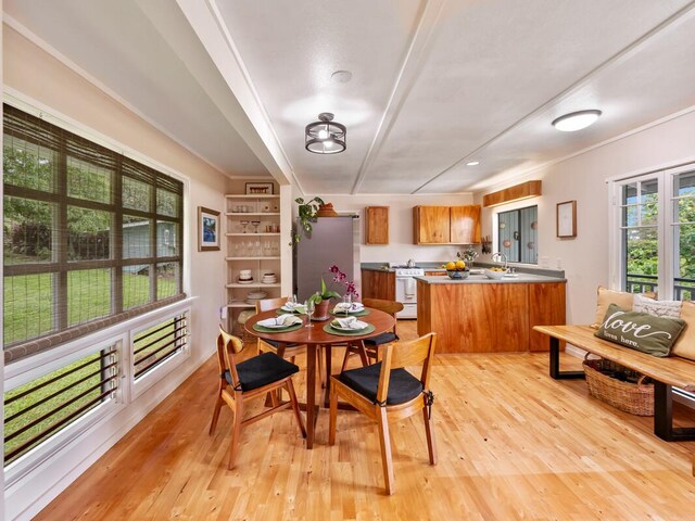 1174 Ainalako Rd, Hilo, HI 96720 - dining room with light wood-type flooring and crown molding
