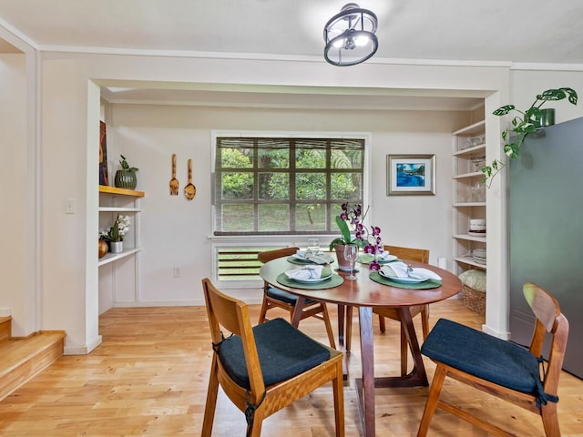 1174 Ainalako Rd, Hilo, HI 96720 - dining space with light wood-type flooring, stairs, and built in shelves