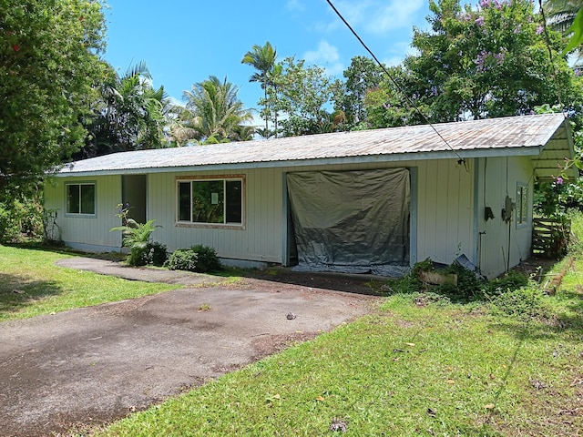 15-2713 Manalo St, Pahoa, HI 96778 - view of front of property with a front lawn and metal roof