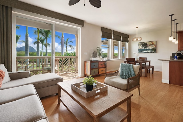 2611 Kiahuna Plantation Dr Unit 15G, Koloa, HI 96756 - living room featuring light wood-style flooring, a ceiling fan, and baseboards