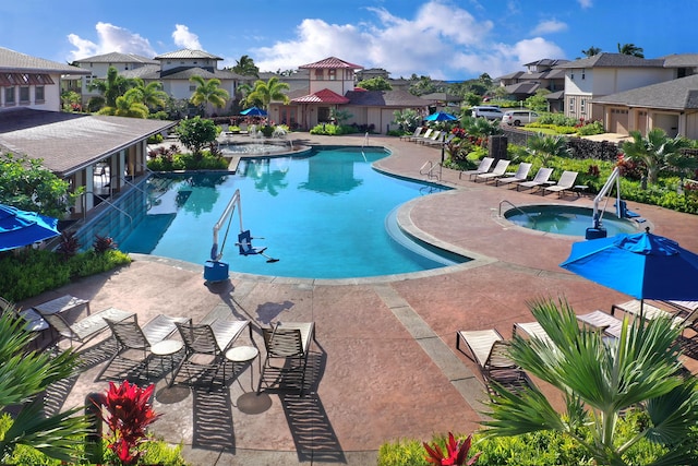 2611 Kiahuna Plantation Dr Unit 15G, Koloa, HI 96756 - community pool featuring a residential view, a patio, and a hot tub