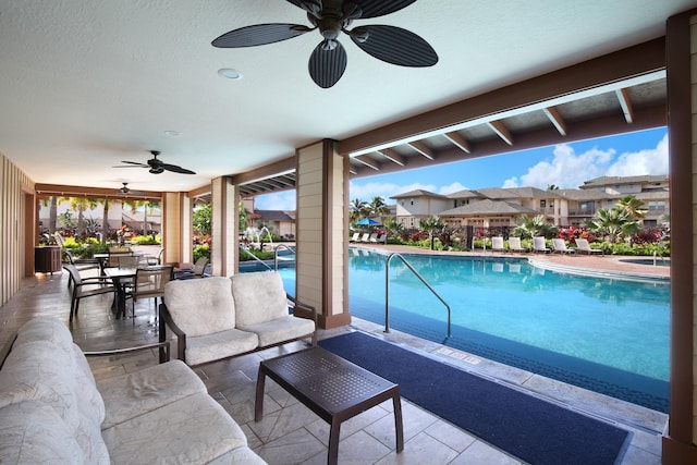 2611 Kiahuna Plantation Dr Unit 15G, Koloa, HI 96756 - community pool featuring ceiling fan, outdoor lounge area, a patio area, and outdoor dining space